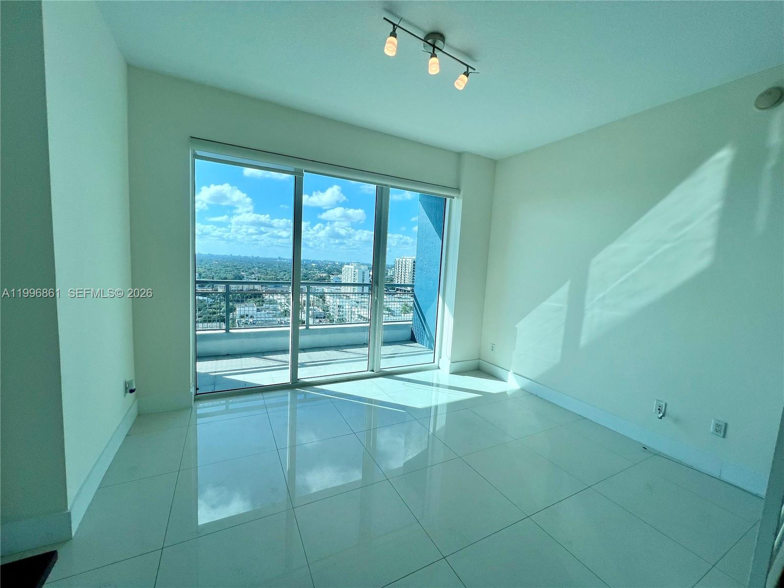 60 Southwest 13th Street, Unit 1611 Miami, FL 33130 - Photo 7 of 28 a view of an empty room with a window