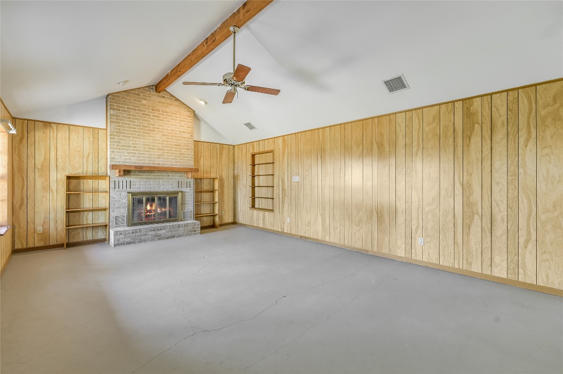 5637 Jeddo Road Waelder, TX 78959 - Photo 11 of 37 a view of an empty room with a fireplace and a window