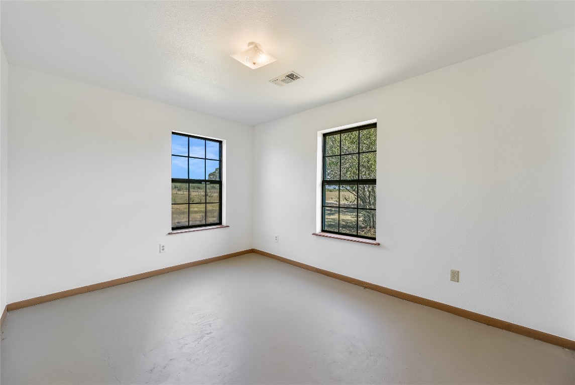 5637 Jeddo Road Waelder, TX 78959 - Photo 18 of 37 an empty room with a window