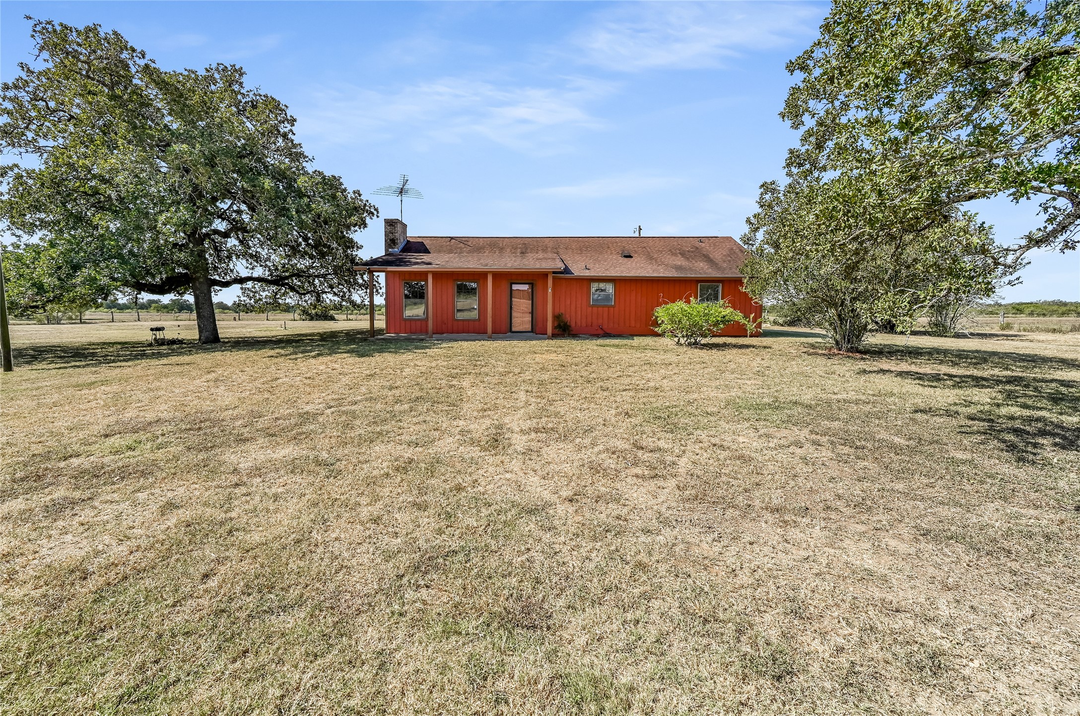5637 Jeddo Road Waelder, TX 78959 - Photo 3 of 37 a front view of a house with a yard and a garage