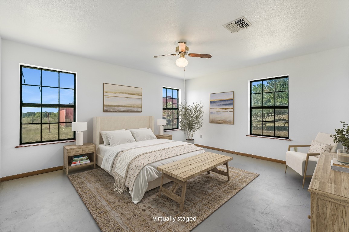 5637 Jeddo Road Waelder, TX 78959 - Photo 6 of 37 a spacious bedroom with a large bed and a window