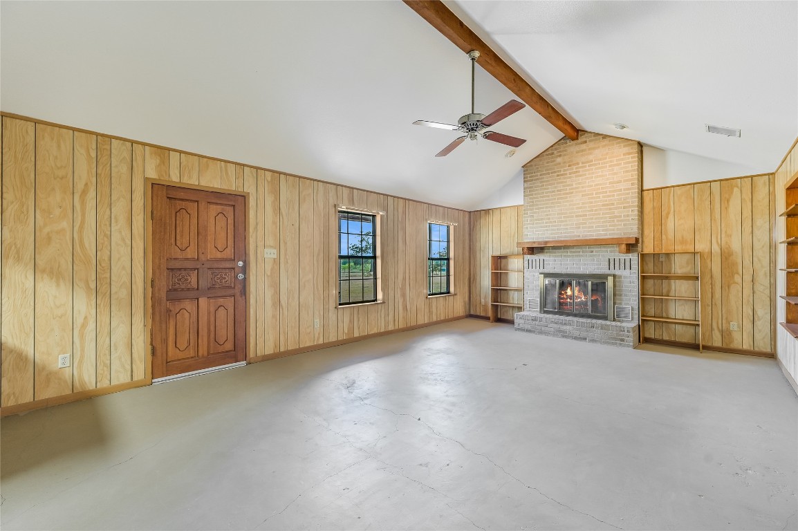 5637 Jeddo Road Waelder, TX 78959 - Photo 9 of 37 a view of a livingroom with an empty space and a fireplace