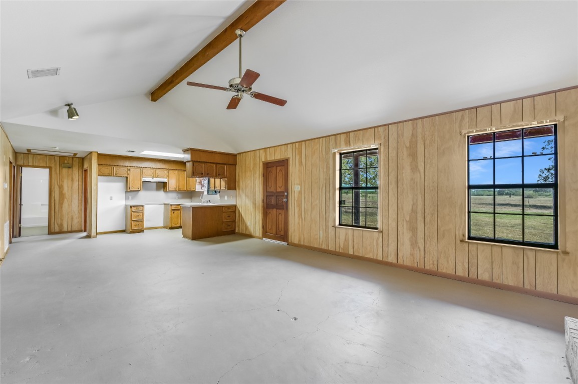 5637 Jeddo Road Waelder, TX 78959 - Photo 10 of 37 a view of an empty room with a window and a kitchen