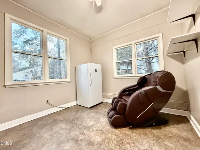 a view of a house with wooden deck