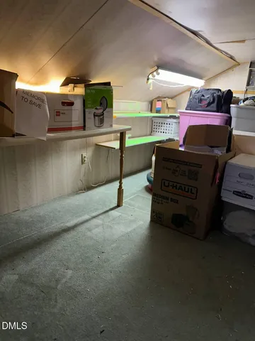 a front view of a building with street view and trees