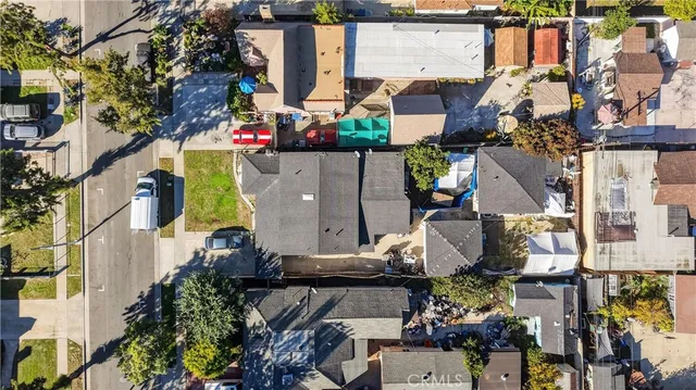 an aerial view of houses with outdoor space