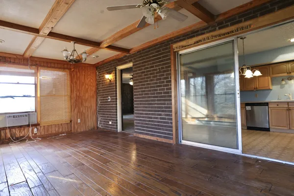 a bedroom with furniture and a window
