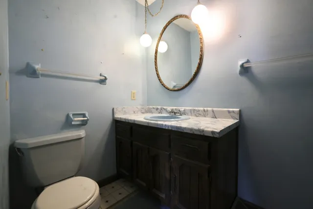 a bathroom with a sink and toilet