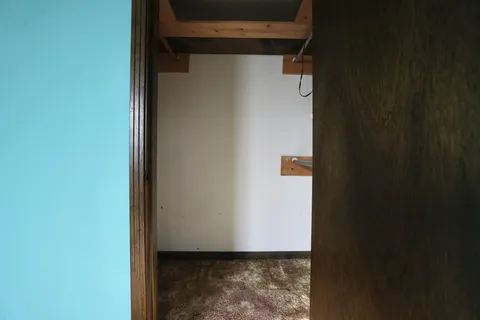 a bathroom with a granite countertop sink a mirror and shower
