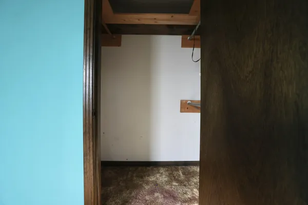 a bathroom with a granite countertop sink a mirror and shower