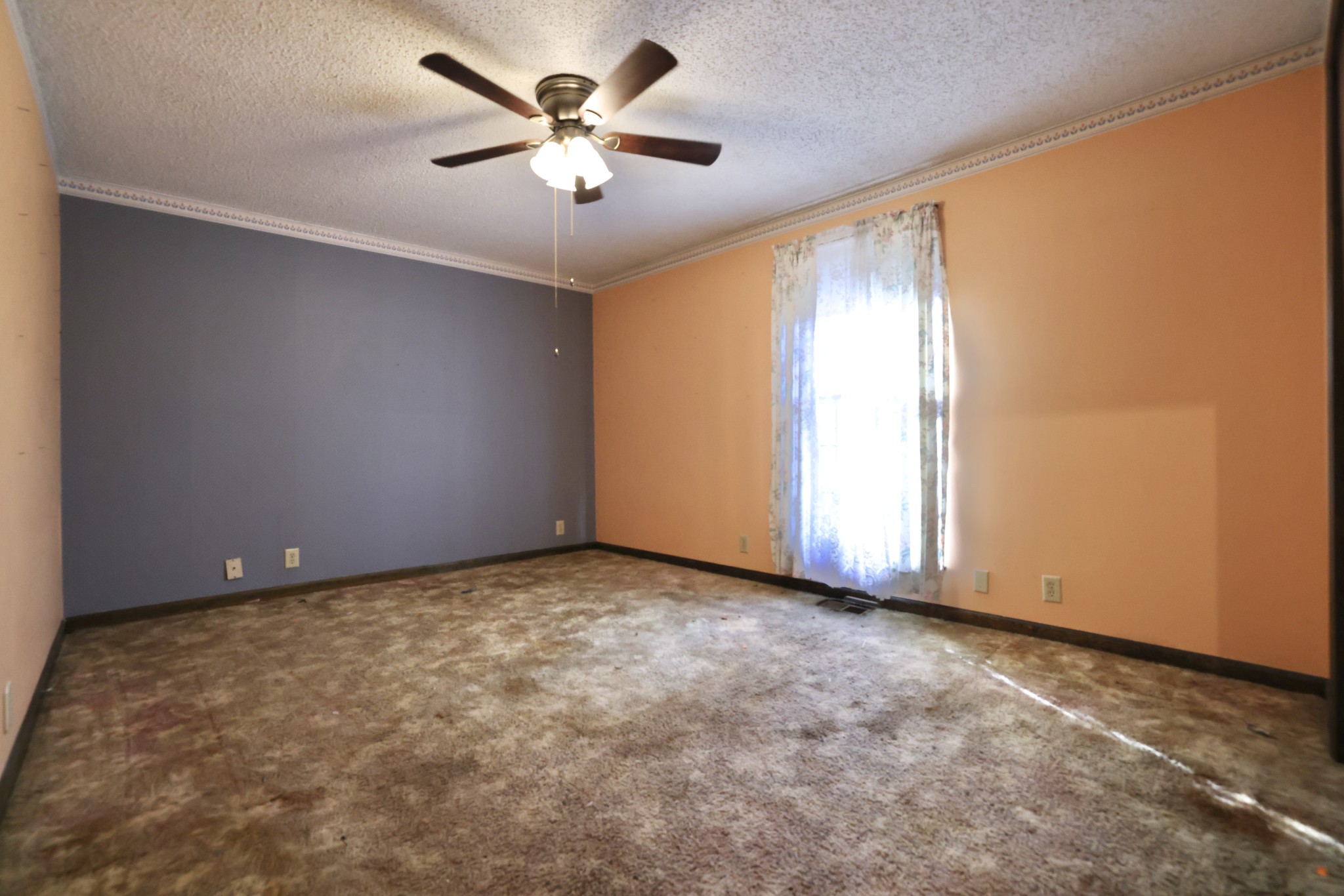 1170 Madison Creek Road Goodlettsville, TN 37072 - Photo 27 of 32 an empty room with a chandelier fan and windows