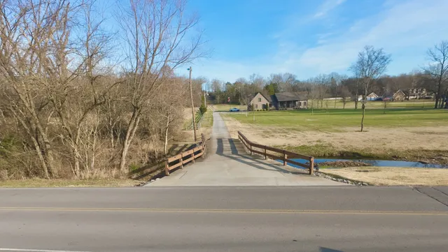 a sign board with street view