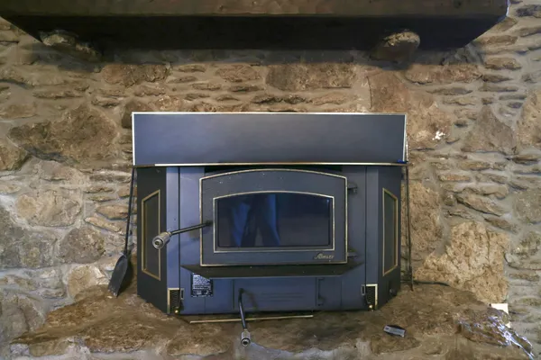 a kitchen view with a refrigerator a stove a sink and a window