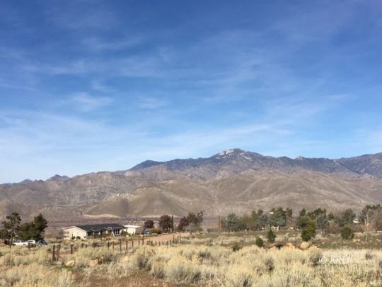 0 Pioneer Road Weldon, CA 93283 - Photo 7 of 14 a view of a mountain range in a cloudy sky