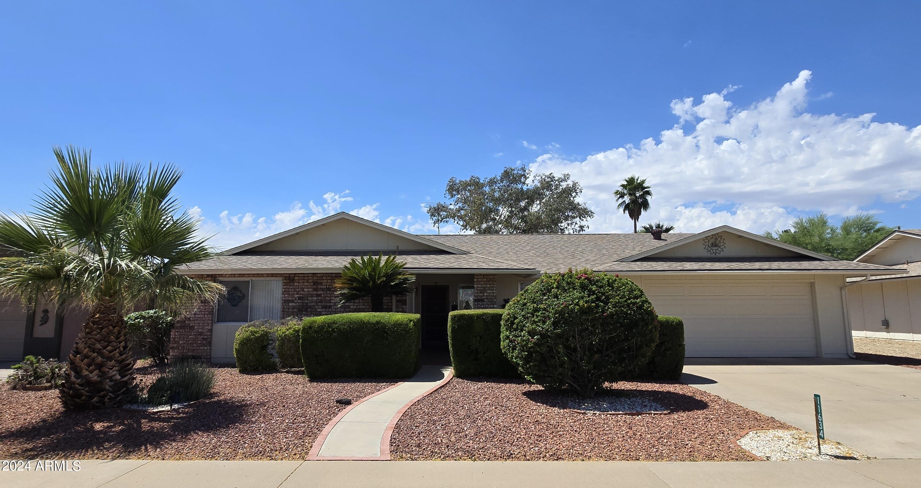 11634 North Rio Vista Drive Sun City, AZ 85351 - Photo 1 of 15 a front view of a house with garden