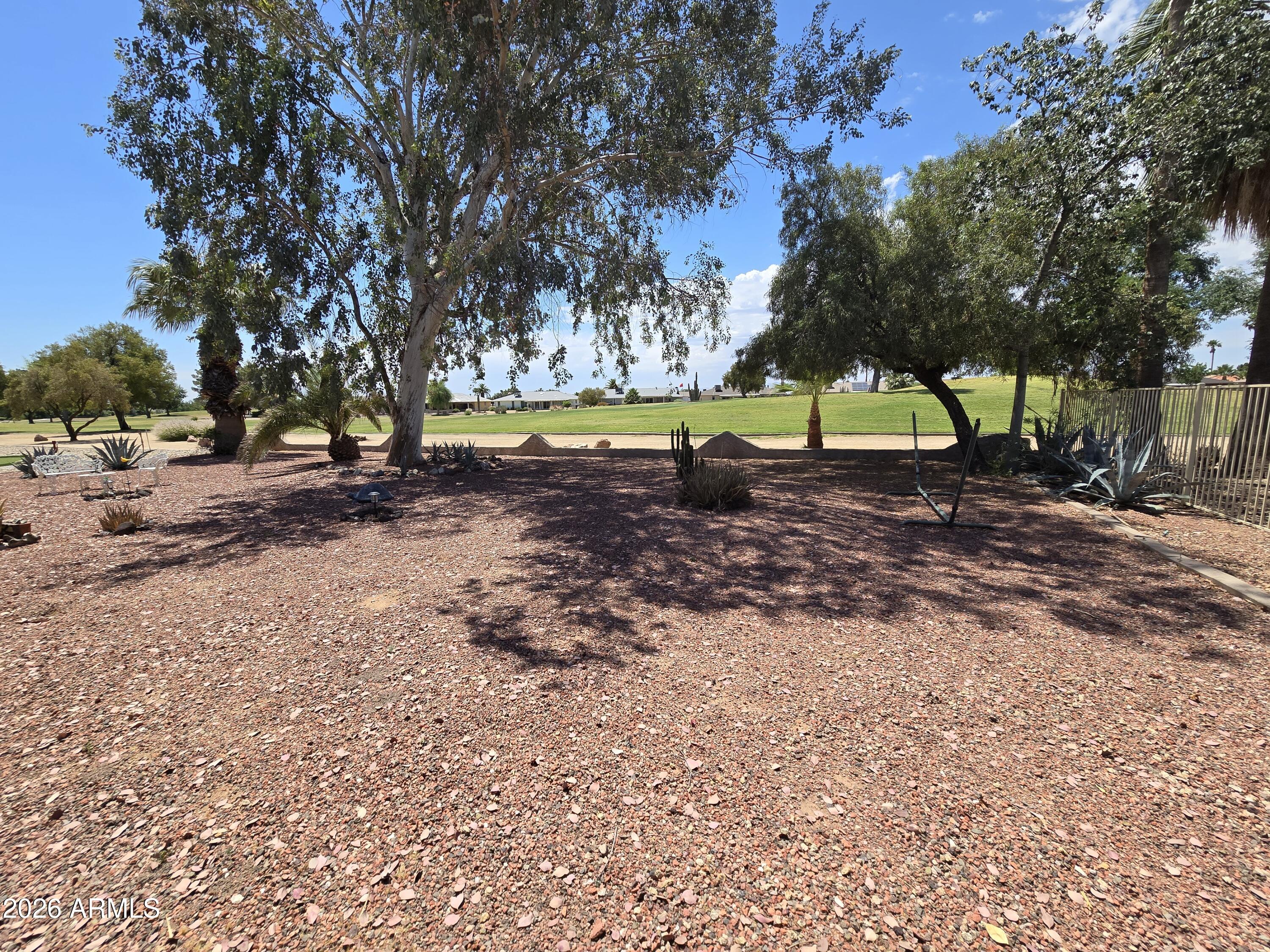11634 North Rio Vista Drive Sun City, AZ 85351 - Photo 13 of 15 a view of a dirt road and a trees