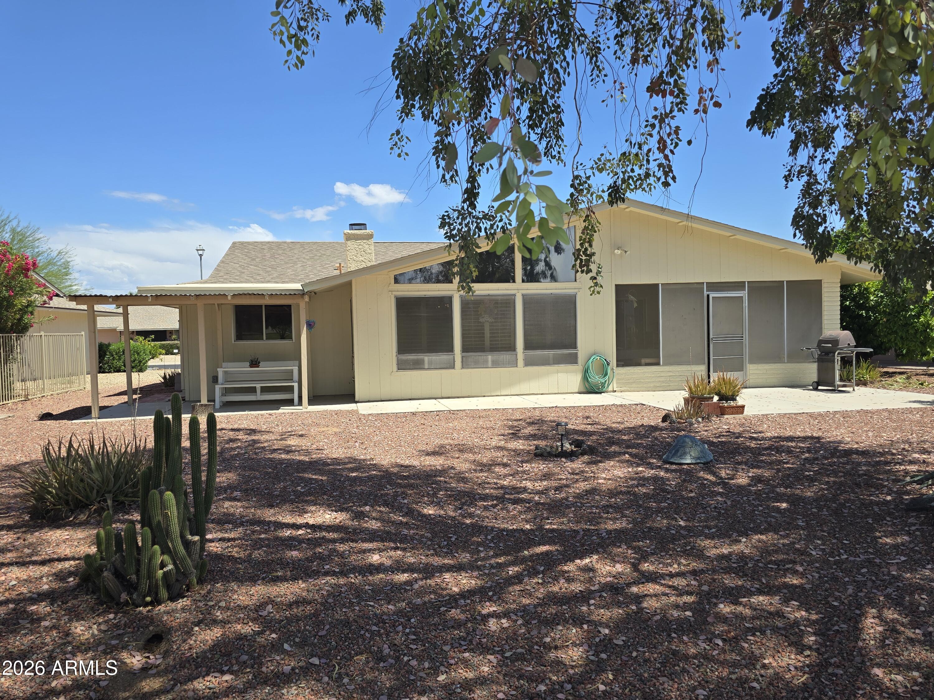 11634 North Rio Vista Drive Sun City, AZ 85351 - Photo 14 of 15 a view of a house with backyard and sitting area