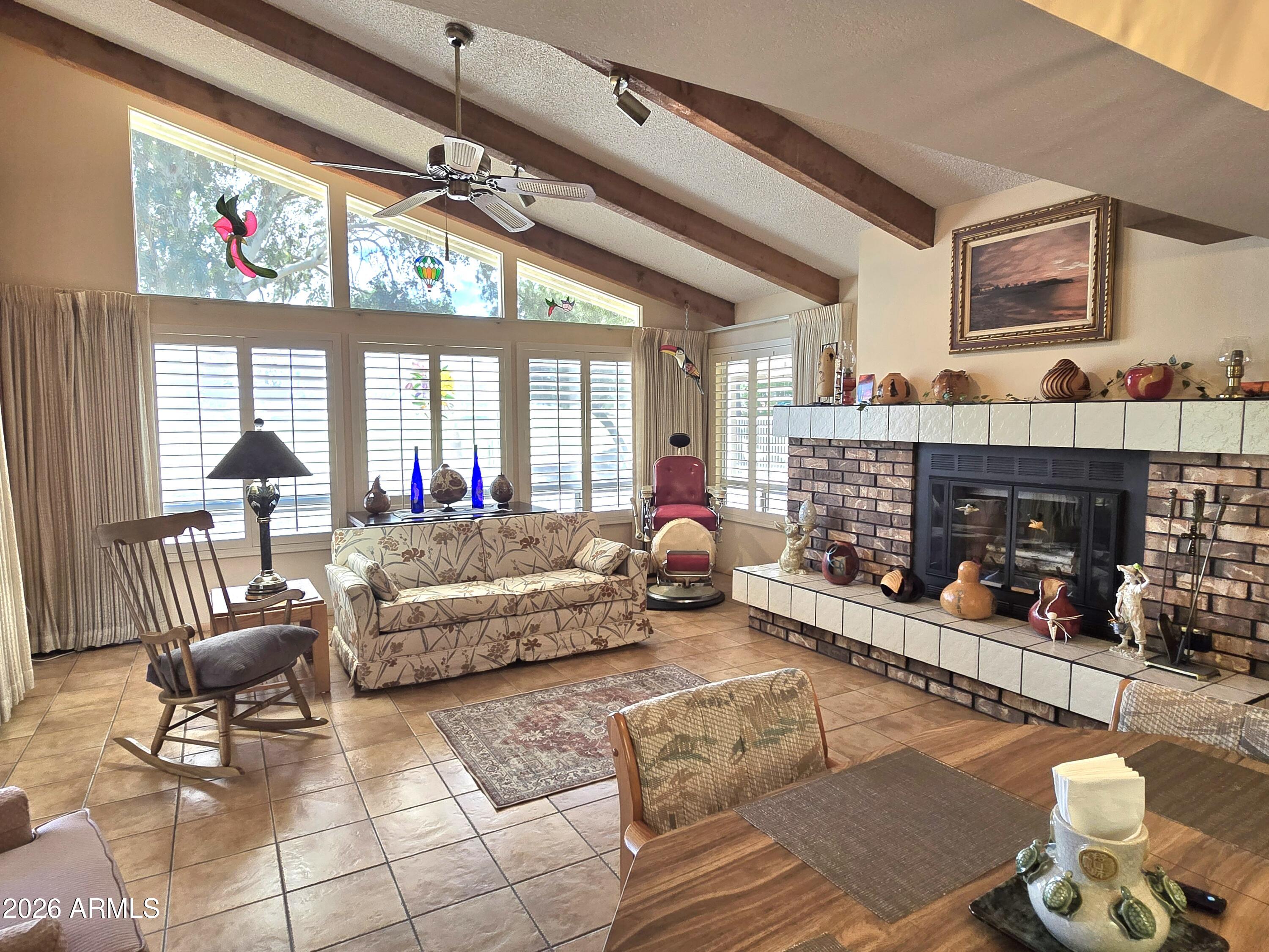 11634 North Rio Vista Drive Sun City, AZ 85351 - Photo 3 of 15 a living room with furniture and a fireplace