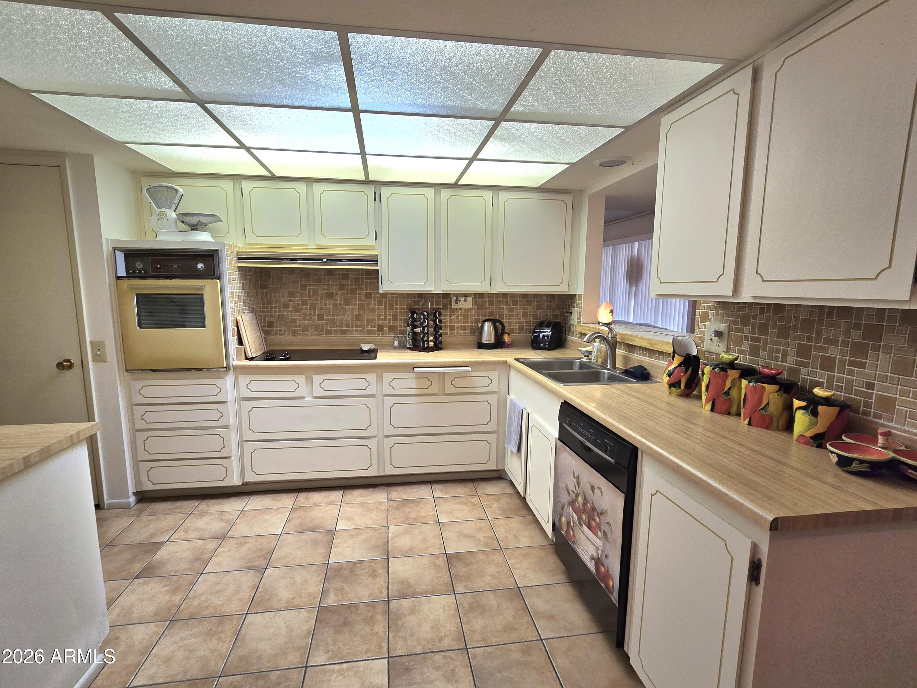11634 North Rio Vista Drive Sun City, AZ 85351 - Photo 9 of 15 a kitchen with a sink and cabinets