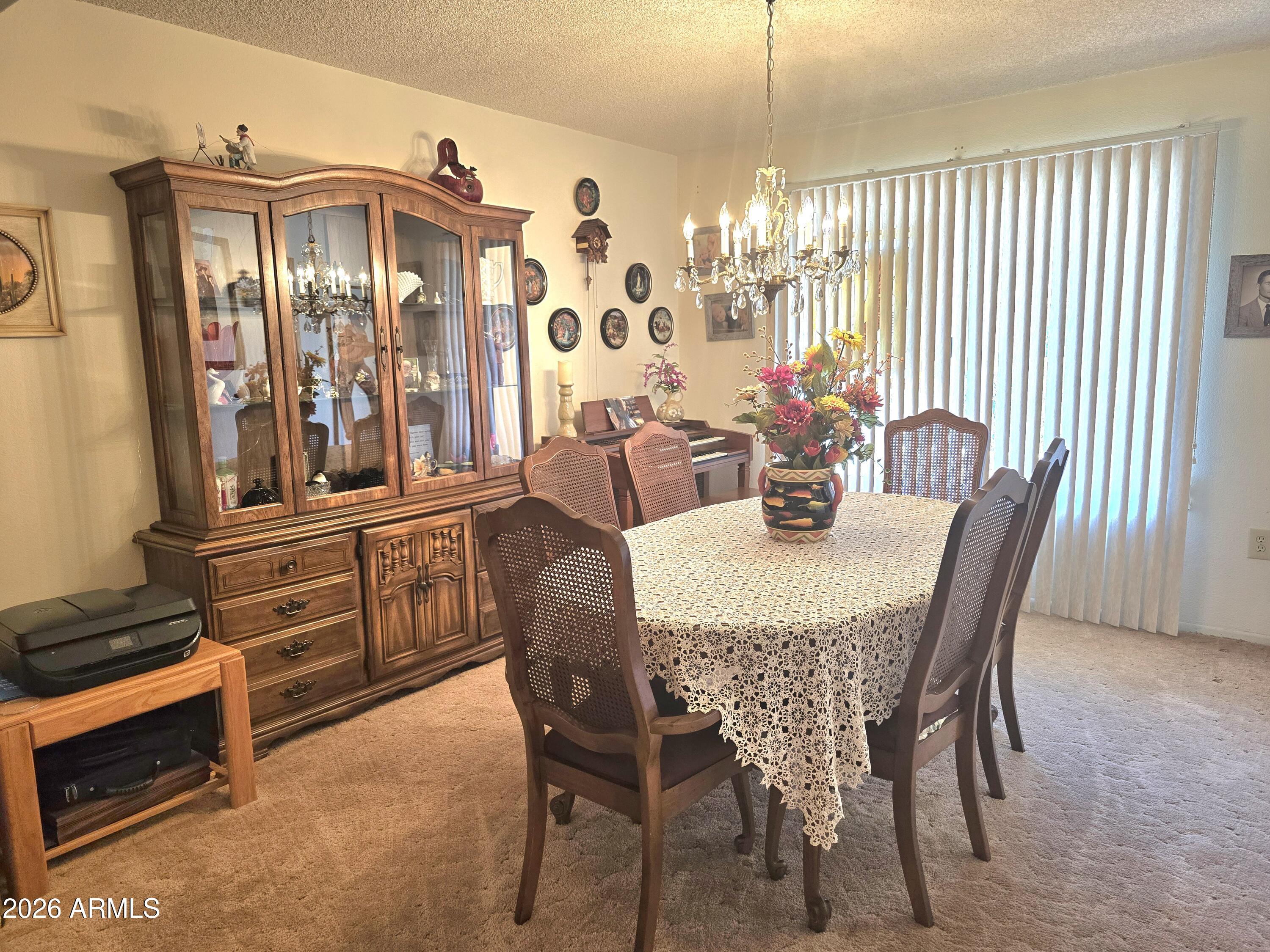 11634 North Rio Vista Drive Sun City, AZ 85351 - Photo 10 of 15 a view of a dining room with furniture window and outside view