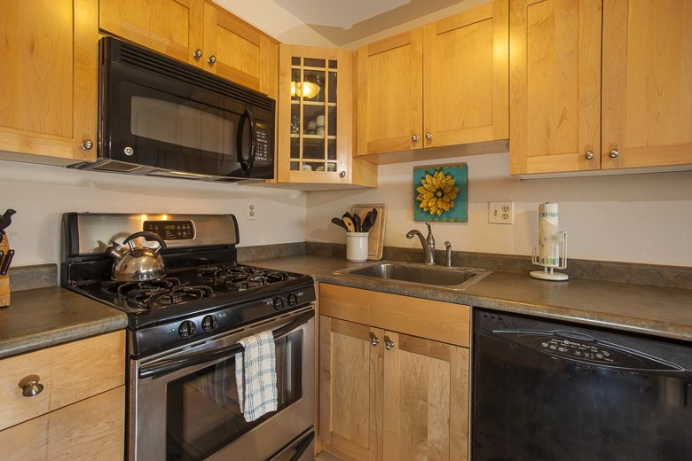 2531 South Kihei Road, Unit C512 Kihei, HI 96753 - Photo 16 of 27 a kitchen with stainless steel appliances granite countertop white cabinets a stove top oven a sink and dishwasher