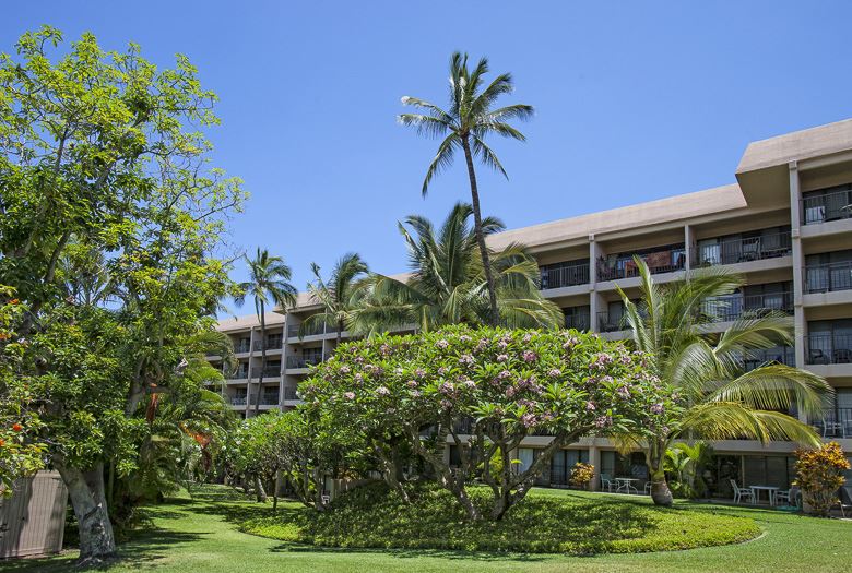 2531 South Kihei Road, Unit C512 Kihei, HI 96753 - Photo 21 of 27 a front view of a multi story building with a yard