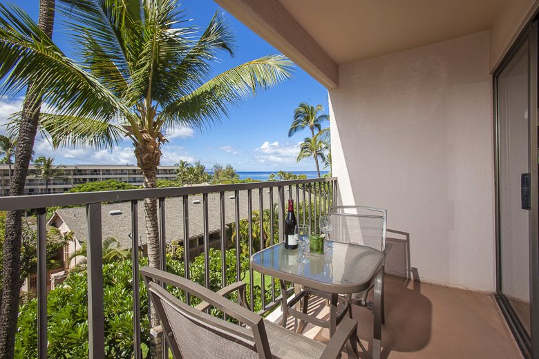 2531 South Kihei Road, Unit C512 Kihei, HI 96753 - Photo 4 of 27 a balcony with furniture and a potted plant