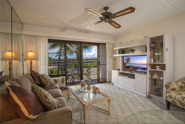 2531 South Kihei Road, Unit C512 Kihei, HI 96753 - Photo 5 of 27 a living room with furniture and a flat screen tv