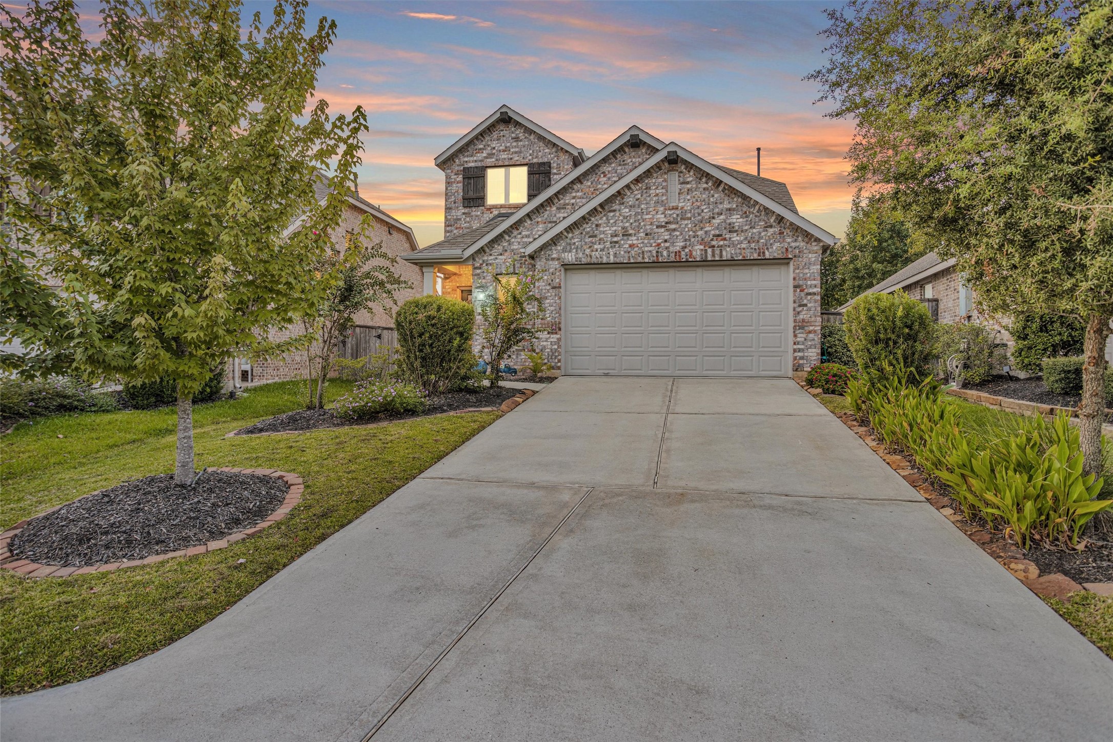 118 Emory Birch Montgomery, TX 77316 - Photo 1 of 35 a front view of a house with a yard and trees