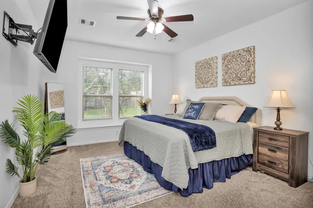 an empty room with windows and closet