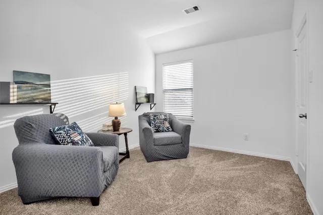 a view of a room that has a window in it