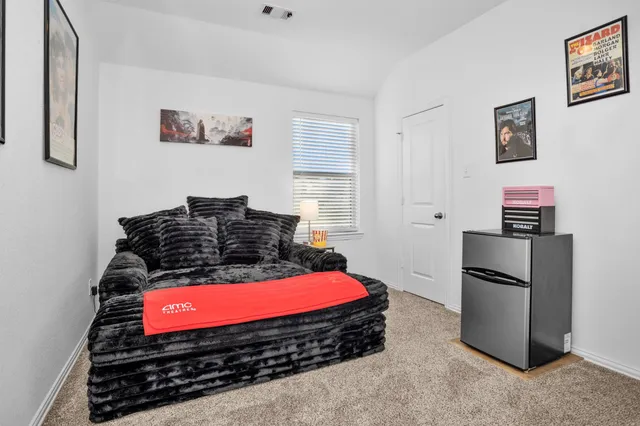 a backyard of a house with table and chairs