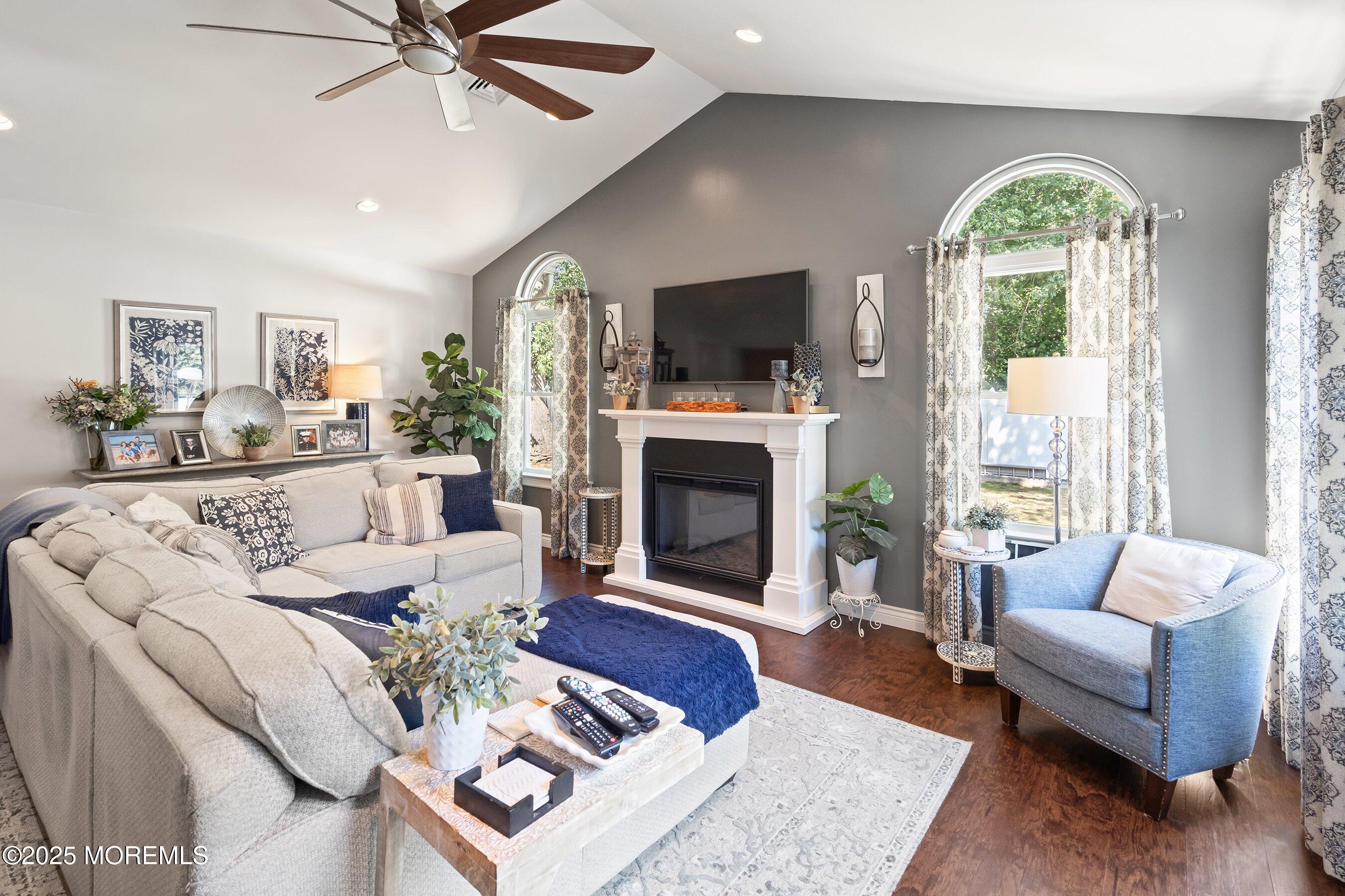 20 Appletree Road Howell, NJ 07731 - Photo 13 of 35 a living room with furniture a flat screen tv and a fireplace
