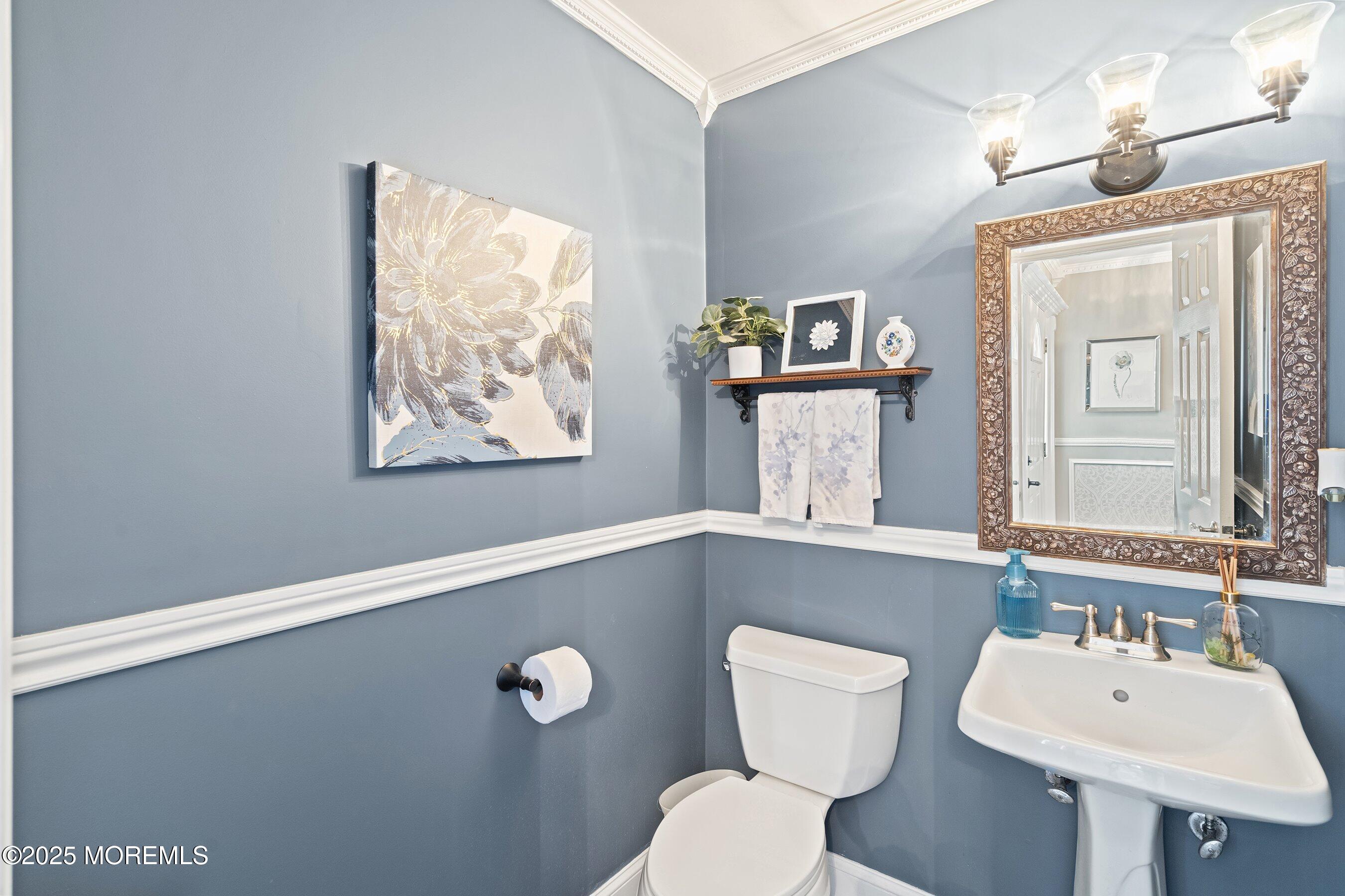 20 Appletree Road Howell, NJ 07731 - Photo 16 of 35 a bathroom with a toilet a sink and mirror