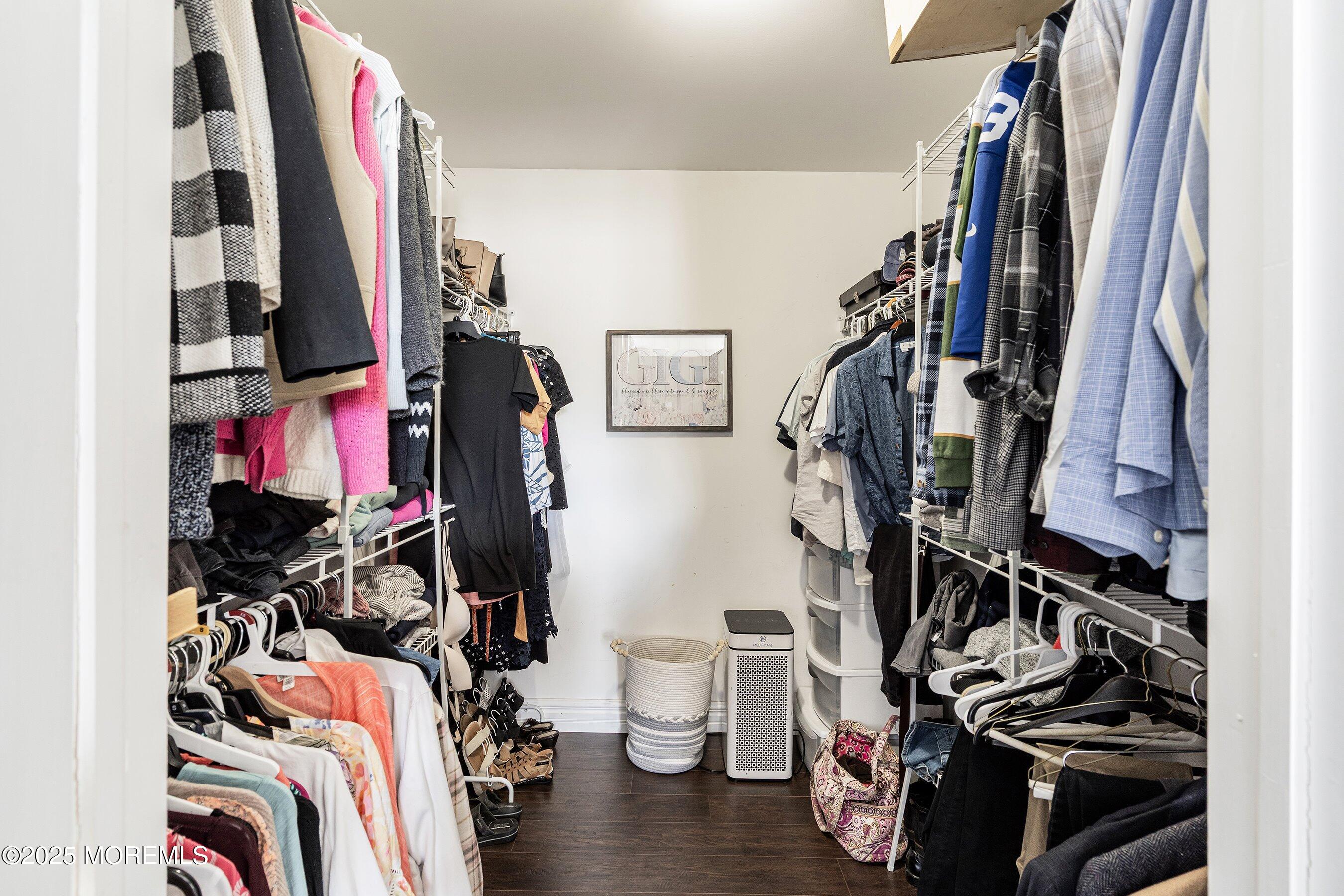20 Appletree Road Howell, NJ 07731 - Photo 20 of 35 a view of walk in closet with clothes and shoes