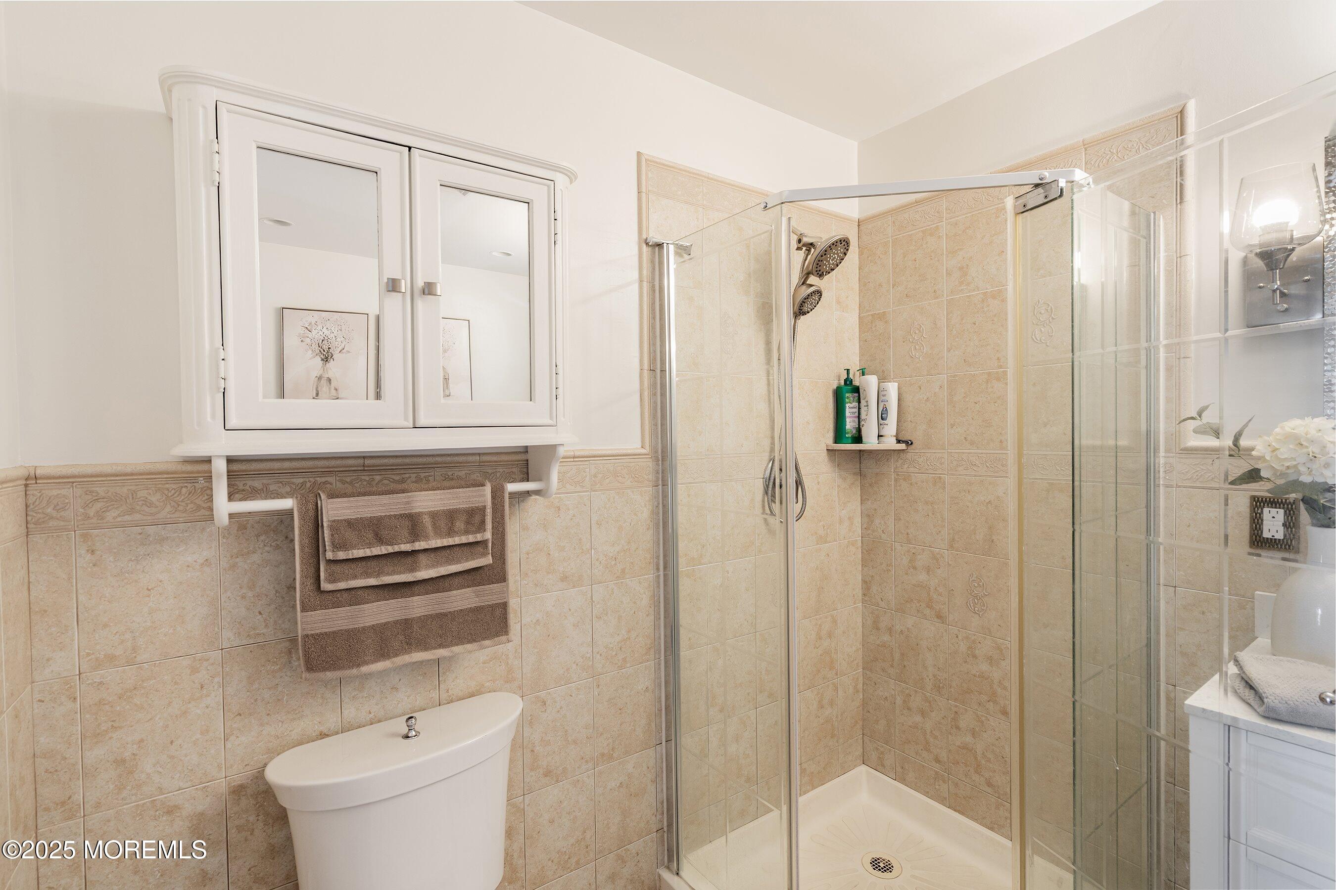 20 Appletree Road Howell, NJ 07731 - Photo 22 of 35 a bathroom with a shower toilet and sink