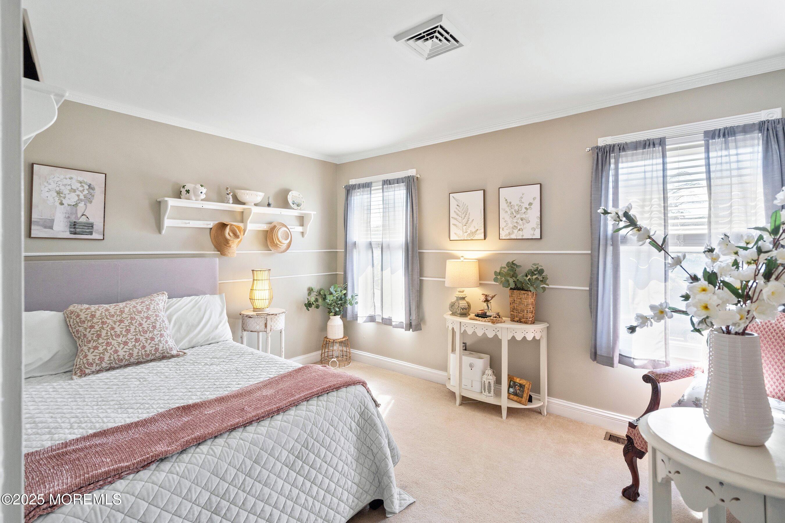 20 Appletree Road Howell, NJ 07731 - Photo 23 of 35 a bedroom with a bed and a chair