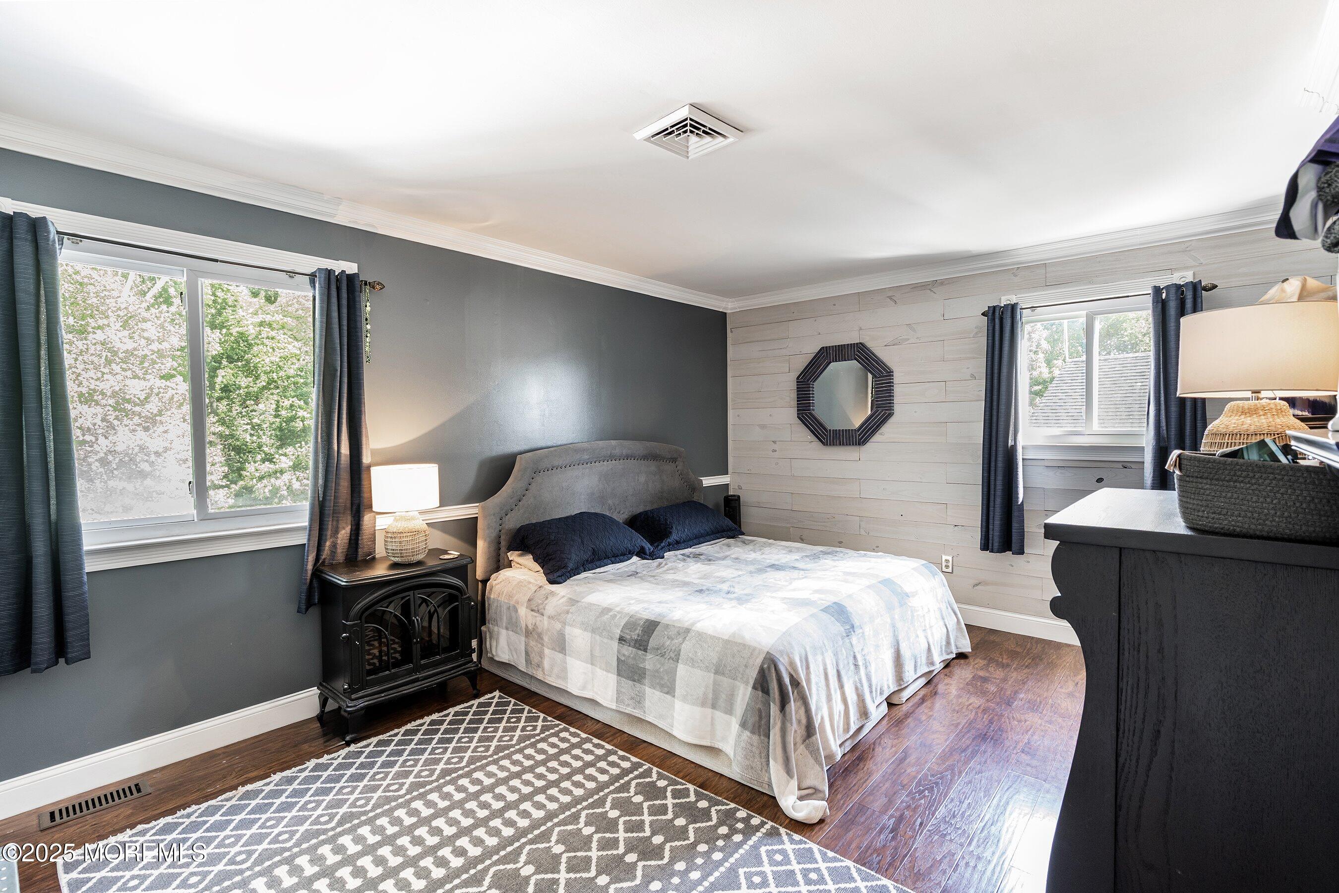 20 Appletree Road Howell, NJ 07731 - Photo 25 of 35 a bedroom with a bed and wooden floor