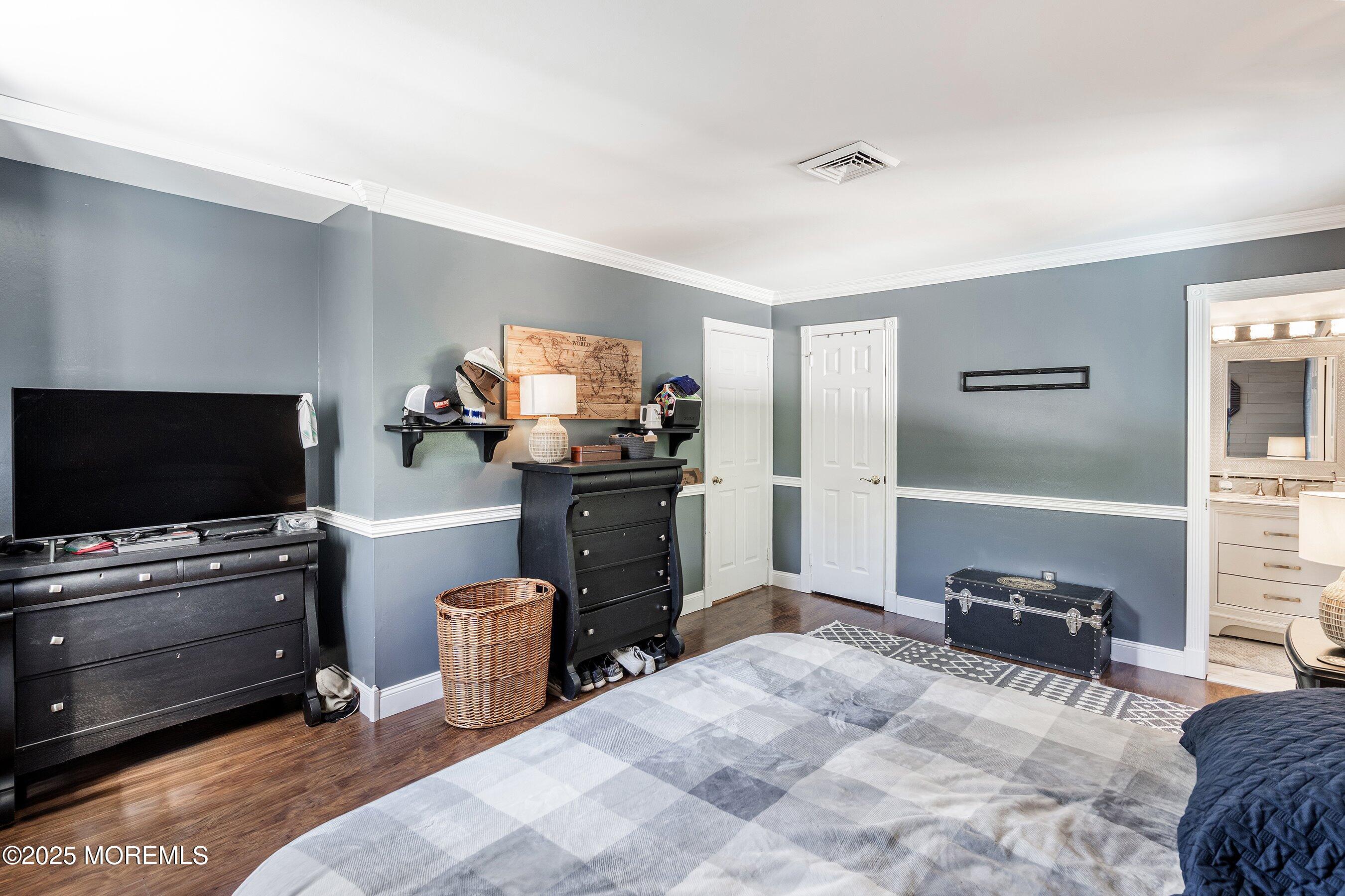 20 Appletree Road Howell, NJ 07731 - Photo 26 of 35 a bedroom with furniture and a flat screen tv