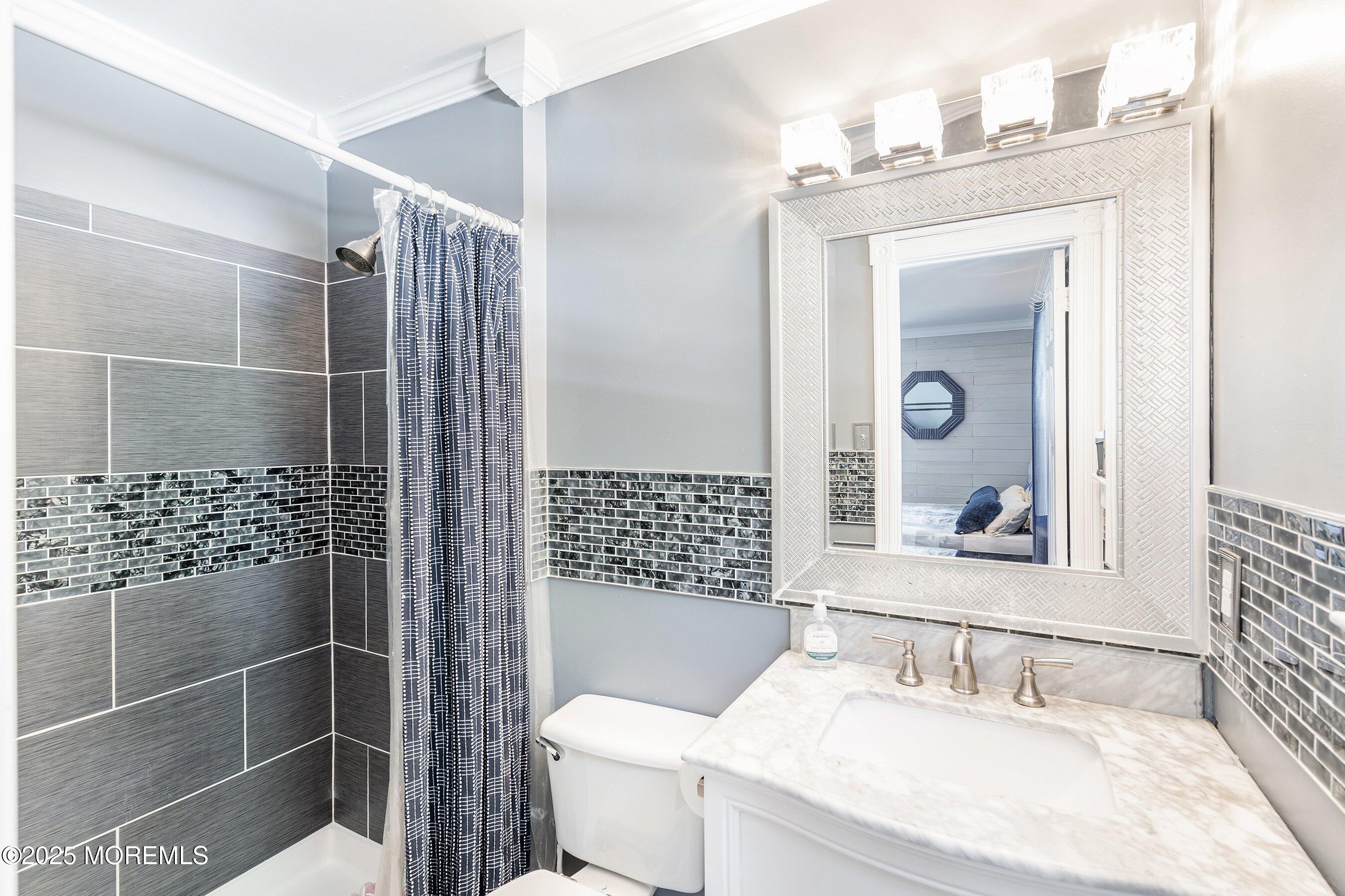 20 Appletree Road Howell, NJ 07731 - Photo 27 of 35 a bathroom with a sink toilet and shower