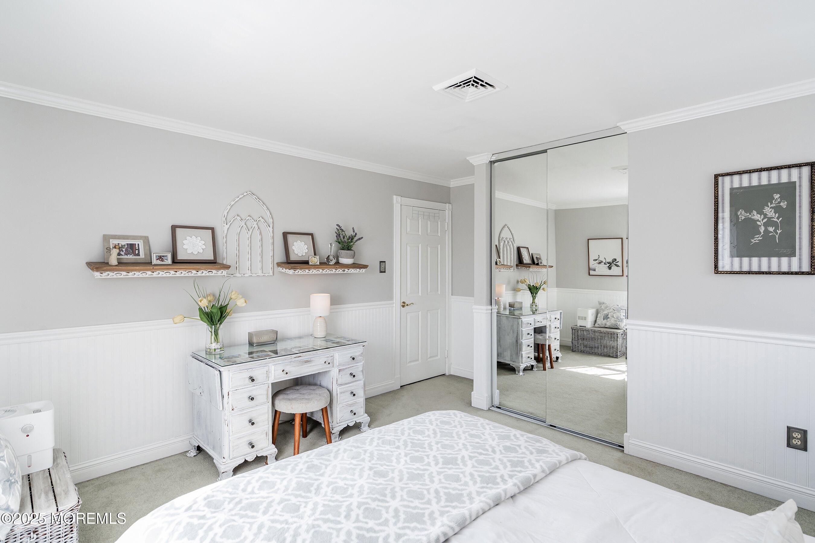 20 Appletree Road Howell, NJ 07731 - Photo 29 of 35 a bedroom with a bed and a chair