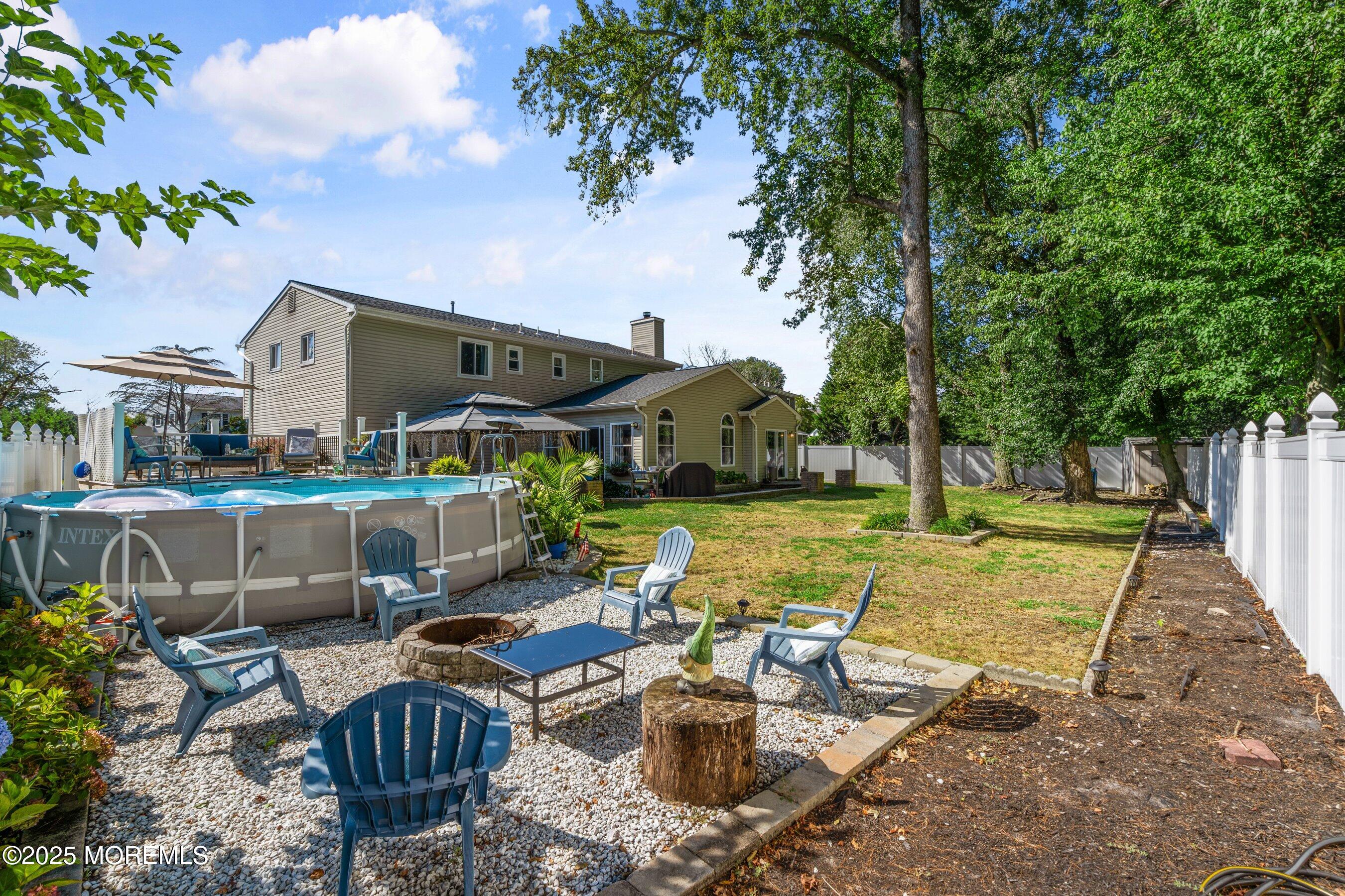 20 Appletree Road Howell, NJ 07731 - Photo 33 of 35 a view of swimming pool with outdoor seating and plants