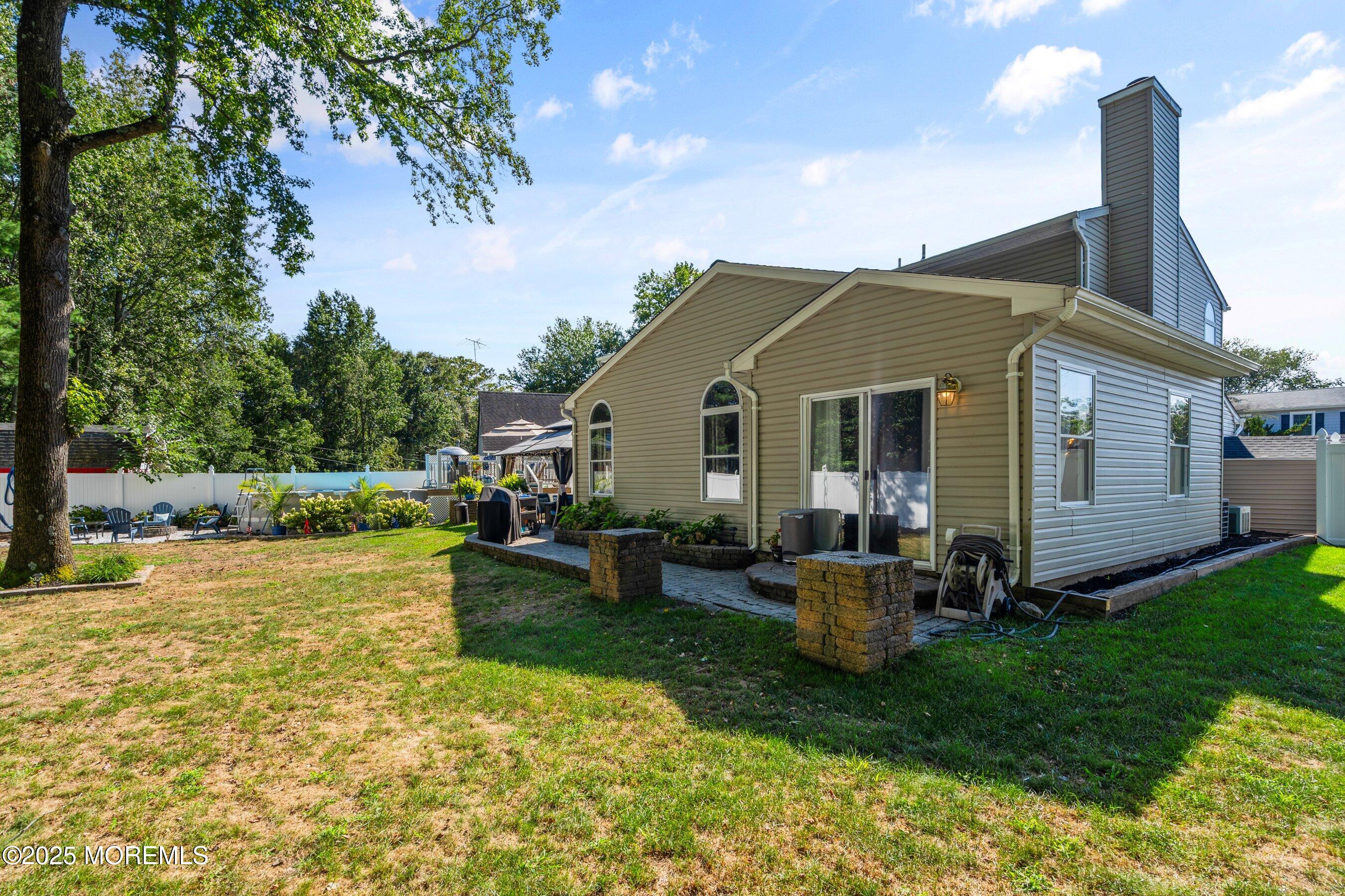 20 Appletree Road Howell, NJ 07731 - Photo 35 of 35 a view of a house with backyard sitting area and garden