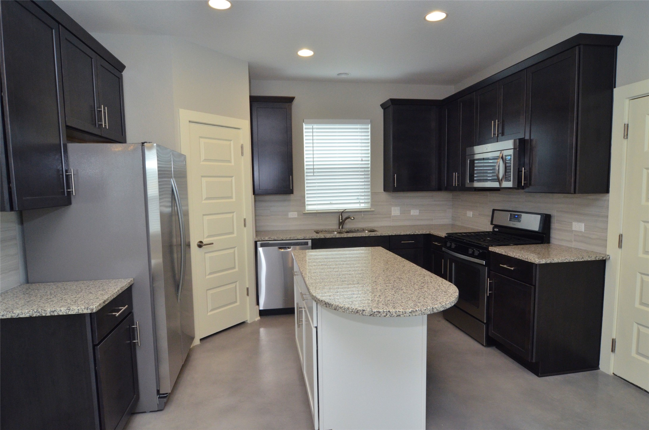 1916 Cleese Drive Austin, TX 78741 - Photo 6 of 36 Granite counters and stainless steel appliances complete this well-appointed kitchen.