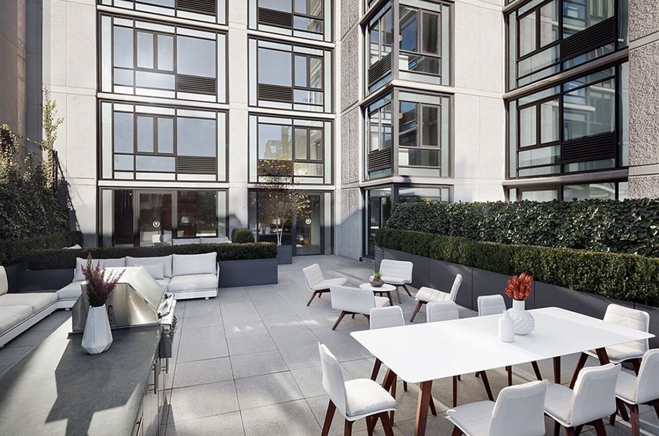 385 1st Avenue, Unit 12D Manhattan, NY 10010 - Photo 15 of 19 a view of a patio filled with furniture