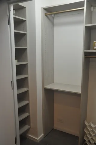 a view of an empty walk in closet