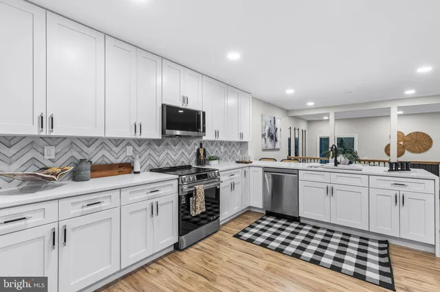 a kitchen with a table and chairs in it