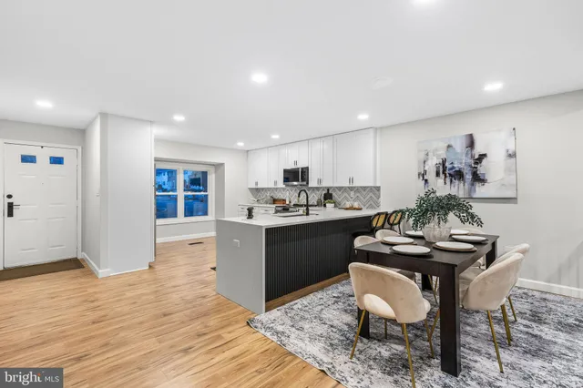 a kitchen with a table and chairs in it
