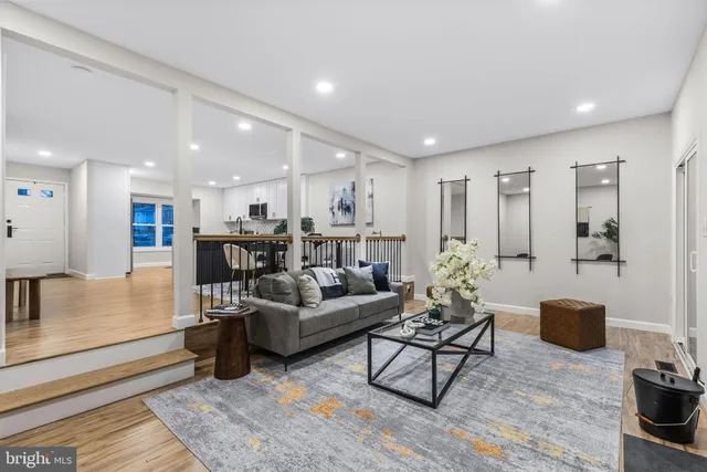 a living room with furniture and a table