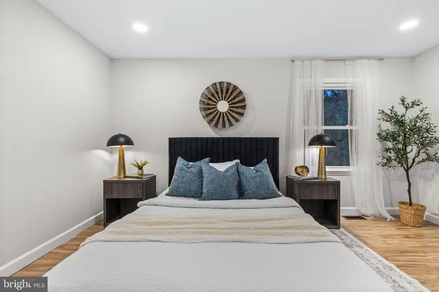 a bedroom with a bed and lamps